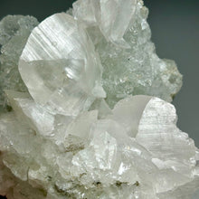 Load image into Gallery viewer, Light green mint fluorite with large calcite from China