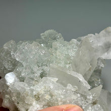 Load image into Gallery viewer, Light green mint fluorite with large calcite from China