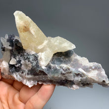 Load image into Gallery viewer, Self - stand Dogtooth calcite with fluorite on matrix
