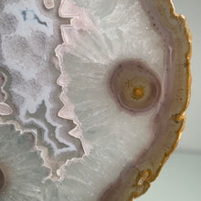 Load image into Gallery viewer, Rare - Agate slice in stand with nice pink druzy pattern in center
