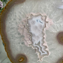 Load image into Gallery viewer, Rare - Agate slice in stand with nice pink druzy pattern in center
