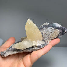 Load image into Gallery viewer, Self - stand Dogtooth calcite with fluorite on matrix
