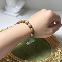 Load image into Gallery viewer, Still Water Bracelet | Agarwood Bracelet | Nepalese Glass Beads | Handmade Artisan Jewelry | Zen Inspired Bracelet
