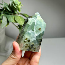 Load image into Gallery viewer, Prehnite crystal tower featuring Epidote inclusions

